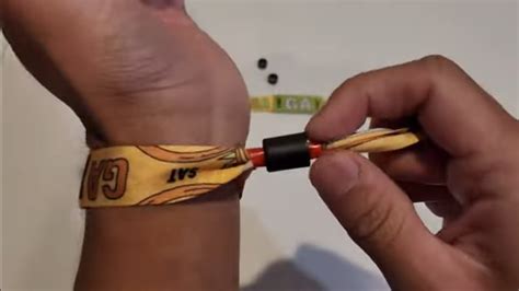 1. The Slip and Twist Method. One of the easiest ways to remove a plastic wristband is by using the slip and twist method. This method involves twisting the wristband in one direction while sliding it off your wrist in the opposite direction. Start by placing your thumb and index finger on either side of the closure..