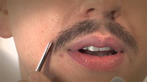 How to trim mustache. To trim a mustache using scissors, follow these steps: Comb the mustache to straighten the hairs and remove any tangles. Hold a pair of grooming scissors at an angle, parallel to the direction of the hair growth. Carefully trim the hairs, working in small sections to maintain control and achieve an even length. 
