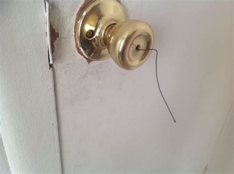 How to unlock a door with a bobby pin. Once you find it, insert a wire or similar object through the hole and press down on the button inside. It’ll open up the lock and allow you to open the door. Move to the next step if it doesn’t work. 2. Look for a Rectangular Slot. If your door has a rectangular slot near the doorknob, that’s a privacy lock. 