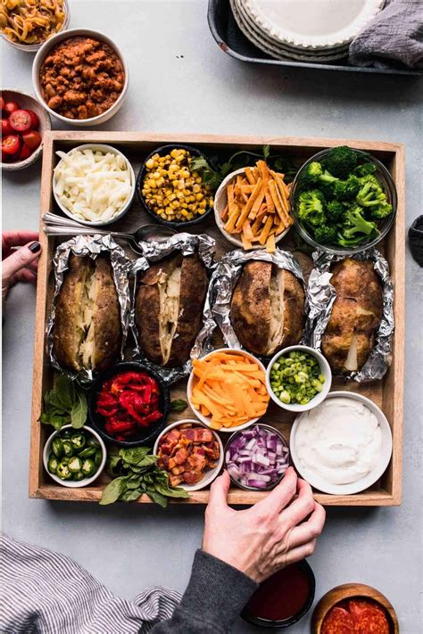 How? Simply serve the baked potatoes on a platter surrounded by traditional toppings like sour cream, crumbled bacon and chives along with more unique options …