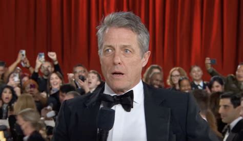 Hugh Grant’s awkward Oscars red carpet interview has people talking