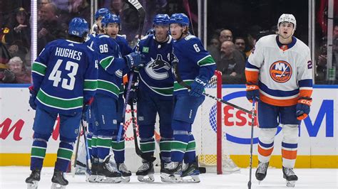 Hughes scores in OT to give Canucks 4-3 win over Islanders
