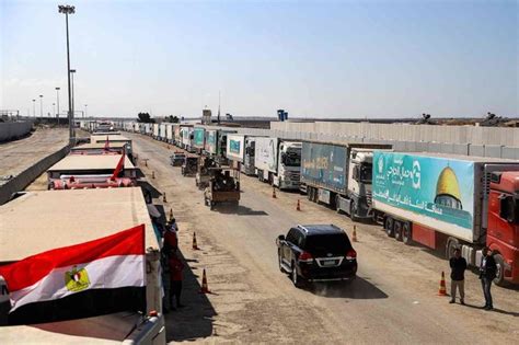 Humanitarian aid convoy begins crossing into Gaza Strip from Egypt