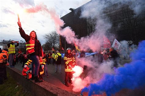 Hundreds detained in fiery protests after French government forces through higher retirement age