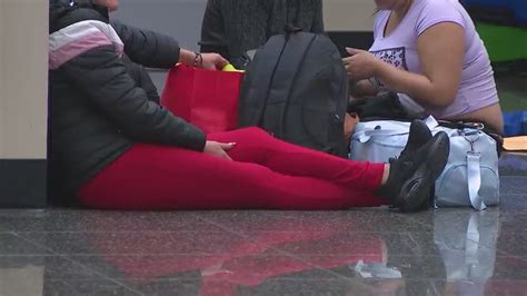 Hundreds of migrants sleep each night at the San Diego airport before flights