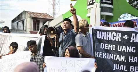 Hundreds of residents on Indonesian island protest the growing arrival of Rohingya refugees by sea