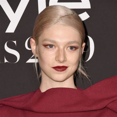 Hunter Schafer has sculpted abs and legs in two colorful 