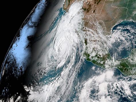 Hurricane Hilary downgraded to Category 2 as Mexico and California brace for catastrophic impact
