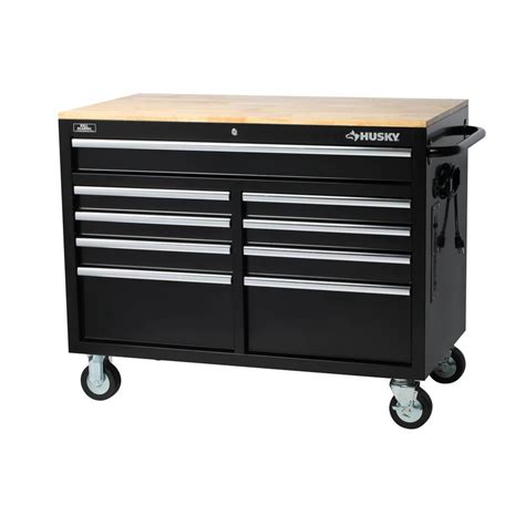 Husky toolbox wood top. This workbench is 24 in. deep, which is 6 in. deeper than most standard rolling tool cabinets and supports up to 2,500 lbs. and has 31,721 cu. in. capacity. The 1.2 in. thick, solid wood top is coated with polyurethane for added utility and durability. Charge your power tools with the built-in, 6-outlet, 2 USB power center. 