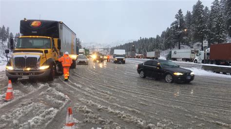 A Caltrans tow truck is surrounded by snow along a closed Interstate 80 near Donner Pass on Saturday, March 2, 2024, after authorities shut down the major freeway due to whiteout conditions. A ...