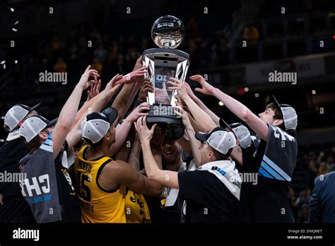 INDIANAPOLIS, IN - MARCH 13: The Iowa Hawkeyes celebrate …