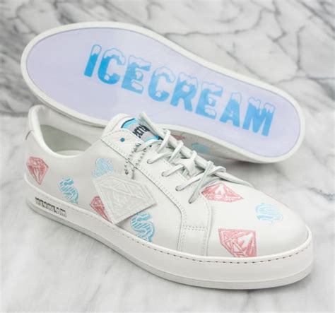 Ice cream sneakers. Blending streetwear with skater style, the Ice Cream footwear line is a collaboration between Pharrell Williams and Reebok. Released from the collection in 2004, the Ice Cream Low 'Diamond Flavor' sneaker is dressed in a muted yellow hue, detailed with matching laces and contrast heel tab. Diamond and dollar sign graphics cover the upper. 
