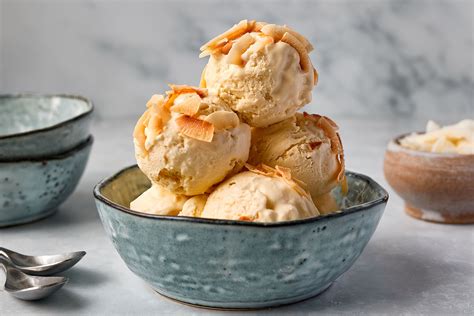 Ice cream with coconut cream. Bring milk, heavy cream, coconut milk, and coconut flakes to simmer in heavy saucepan for a few minutes. Allow to steep for 10 minutes. Whisk the egg yolks, sugar, and salt together, long enough ... 