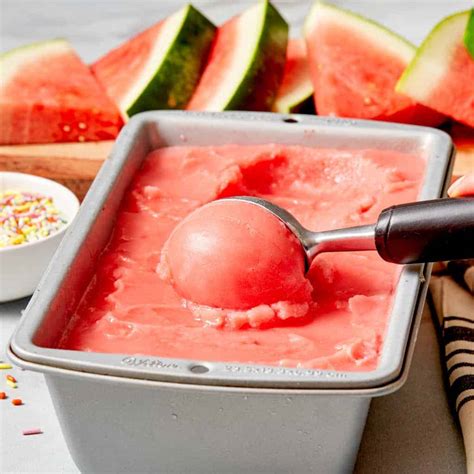 Ice cream with watermelon. Remove from heat and allow the syrup to completely cool. Once cool, stir in the watermelon juice and lemon or lime juice. Pour the mixture into a 9×5 metal baking pan, loaf pan, or freezer-safe container. Freeze until firm (about 4 hours), stirring with a fork every thirty minutes for the first 3 hours. 