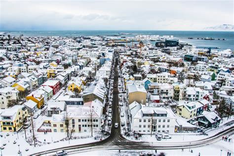 Iceland in december. Iceland is relatively green compared to Greenland because of its size, its more southern location and the difference in nearby ocean currents. Iceland and Greenland are very close ... 