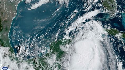 Idalia strengthens to a hurricane, pushing a surge of ocean water toward Florida
