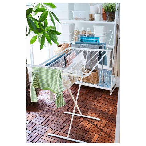 RIGGA Clothes rack, white. You can easily adjust the height to suit your needs as the clothes rack can be locked in place at 6 fixed levels. There is room for boxes or 4 pairs of shoes on the rack at the bottom. . 