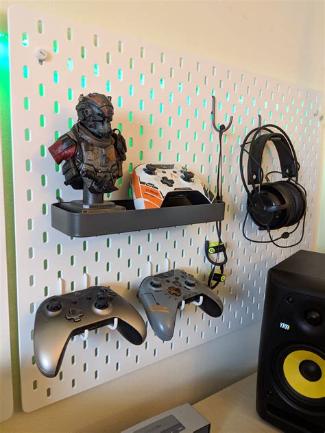 if you go to the ikea site and look up gaming they have the peg board in black and they also have elastic straps that work with their pegboard. ... Dang it, I knew I should have gotten this pegboard. I've been thinking about how to set my Switch up since I don't have a lot of space on my dresser the TV is on, lol..