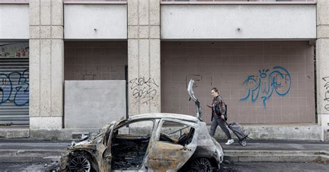 In French town under curfew, wave of violence leaves locals dazed and angry