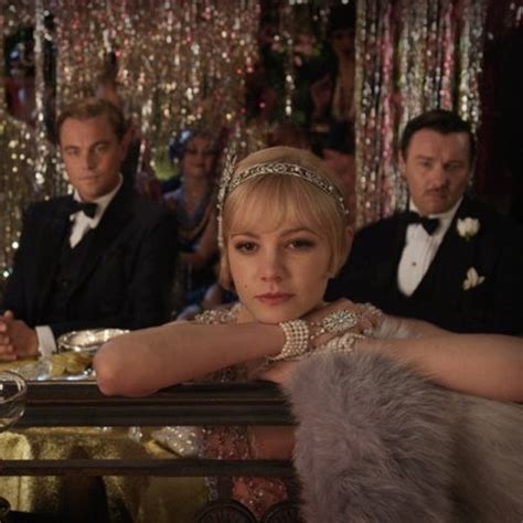 In chapter 7 of The Great Gatsby, how does Nick compare Daisy …