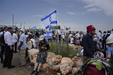In mass rally, Israeli settlers march to West Bank outpost