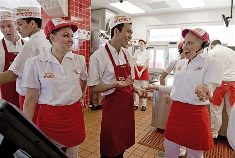 In n out uniform. To make the In-N-Out nametag, you can find their logo online with a simple Google image search. Then in a program like Photoshop, add your own name to the middle of the nametag. Print it out on white cardstock and glue a pinback to the back. 5. Put on your white shirt, white pants, and the rest of the pieces you created. 
