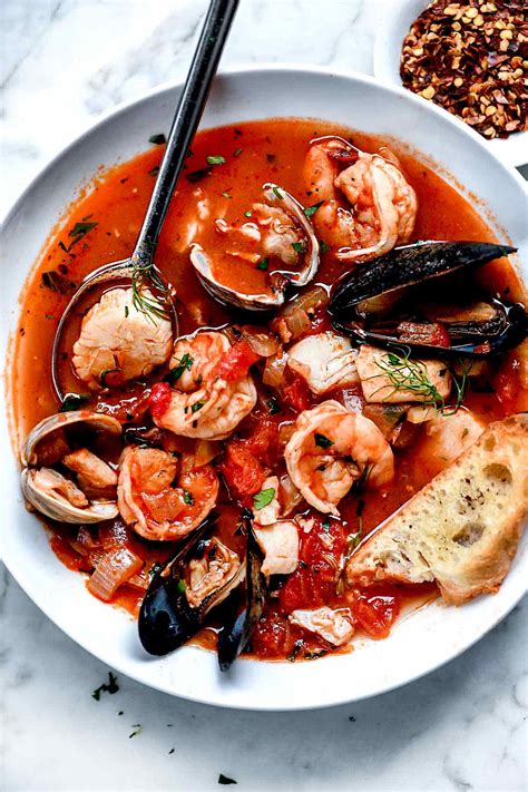 Cioppino is a comforting San Franciscan seafood stew filled with shrimp, clams, mussels, white fish, and crab legs simmered in a rich broth made from tomatoes, white wine, and fish stock. A family favorite, enjoy this easy and delicious one-pot Cioppino Recipe for a special weeknight or holiday meal.. 