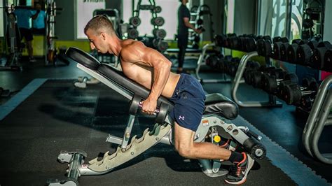 Incline dumbbell rowing. Hang the dumbbells beneath you using a neutral grip. Keep your head up and bring your shoulder blades together as you row the weights towards your chest. Lower to the starting position under ... 