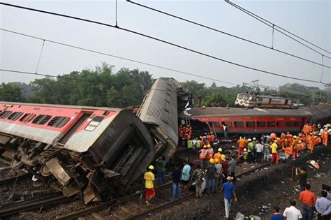 Indian Prime Minister Narendra Modi visits the scene of train crash that killed more than 280