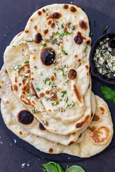 Indian cooking naan. Add the olive oil, milk, and Greek yogurt and stir until dough comes together. If it is dry, add a bit more milk; if it is very sticky, add a sprinkle more flour. Knead for about 30 seconds to a … 