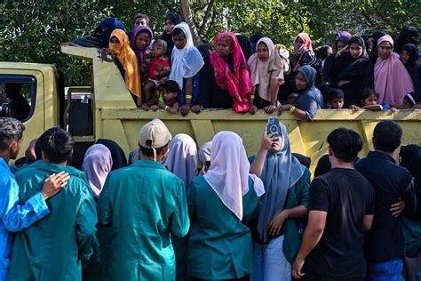 Indonesia’s navy pushes a boat suspected of carrying Rohingya refugees out of its waters