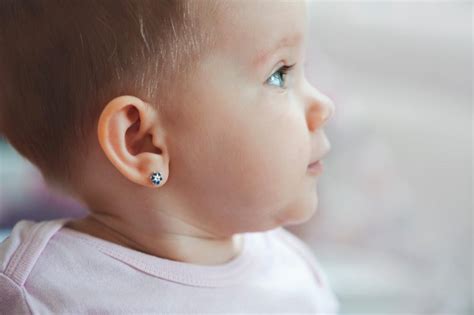 Infant ear piercing. Taking good care of your baby’s newly pierced ears can aid a quicker healing process and reduce the risk for infection. Here are some tips: Only touch the pierced area with clean hands. Refrain from touching them at all. If you do, make sure you’ve thoroughly washed your hands first. Clean the area, front and back, using soap and water only ... 