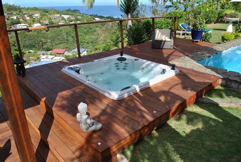 Inground hot tub. The cost of in-ground hot tubs averages between $12,000 and $20,000. In-ground hot tubs can be built with materials, colors, and design elements that match your home’s landscaping or décor. 