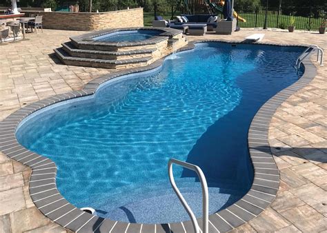 Inground swimming pool cost. How much does an inground concrete pool cost to install? Maintenance and lifetime costs aside, the cost to build a concrete swimming pool begins at $50,000 and can go all the way up to $100,000 or more. Smaller swimming pools will fall on the lower end of this price range, and very large or specialty pools can fall well above the $100,000 mark. 