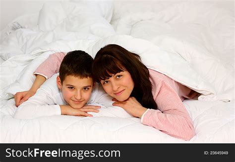 Innocent son share hot mom bed