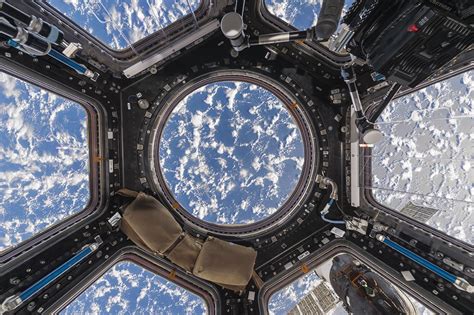 Inside of iss. This image of the interior view from the International Space Station’s Cupola module was taken on Jan. 4, 2015. The large bay windows allows the Expedition 42 crew to see outside. The Cupola houses one of the space station’s two robotic work stations used by astronauts to manipulate the large robotic arm seen through the right window. The ... 