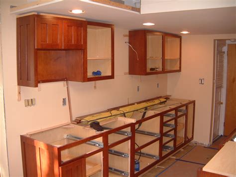 Install kitchen cabinets. Part 1. Marking Layout Lines. Download Article. 1. Use a 4-foot (1.2 m) level to check that your walls are plumb. Take a long level and place it up right against your … 