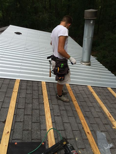 Installing metal roof over shingles. You can screw a metal roof directly to shingles without slip sheets. The shingles are the vapor barrier. Phil explains why, and he's been doing this for over... 