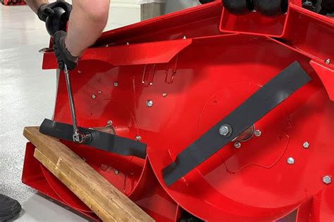 Installing mower blades.  Secures to the mower deck to prevent blade movement.  Shop 4+ millio...