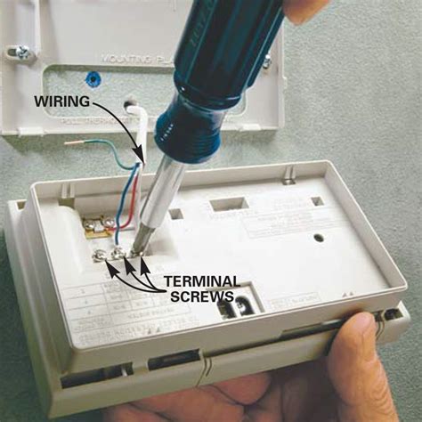 Installing thermostat. Fasten the wires to the wall and ceiling with cable staples. Follow the manufacturer’s easy pushbutton instructions to link the receiver to the thermostat. Mount the thermostat to an inside room wall, away from any windows or heat-producing electronics. Use two hollow-wall anchors to screw the thermostat’s mounting base to the wall. 