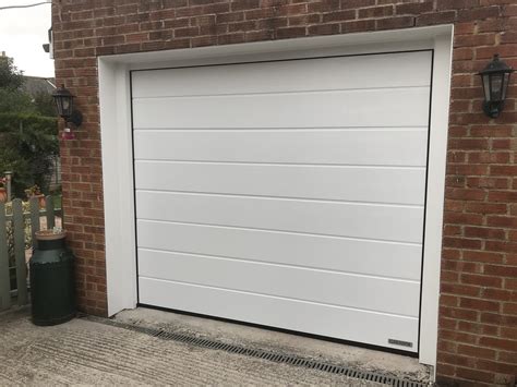 Insulated garage door. A typical composite entrance door = 1.8 W/m²K. A typical single glazed window = 4.8 W/m²K. A typical modern double glazed window = 1.6 W/m2k. A typical standard steel up and over door fitted = 7 W/m2k. A 42mm insulated sectional door fitted = 1.4 W/m2k. Do bear in mind that U-values are really only a guide and there are other factors, as we ... 