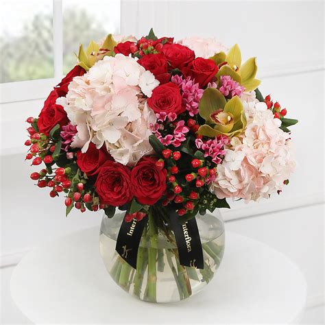 Interflora india. 2 reviews. ₹ 2695. Check. Saved Addresses. Description. Product Info. More Info. Pour out the words from your heart and transform them into a whimsical love sonnet that reveals true passion. Just like this ornate red glitter box that unfurls to reveal an assemblage of farm-fresh red roses, embellished with ribbons, pearl string and a … 