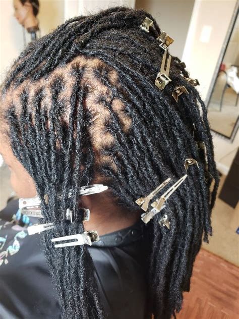 Interlocking dreadlocks. Braidlocs. This method is unique in that it requires a latch hook or nappyloc tool for maintenance. Braidloc sizes range from micro, small, to large braids. In addition, their patterns also take some time to disappear. The initial cost is approximately under $100, and maintenance at home or in a salon costs about $50- $75. 