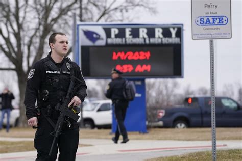 Iowa principal critically injured in school shooting risked himself to protect students, police say