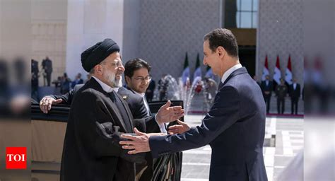 Iran’s president holds rare meeting with Assad in Syria