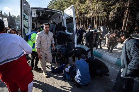 Iran says at least 103 were killed in blasts at a ceremony honoring slain general