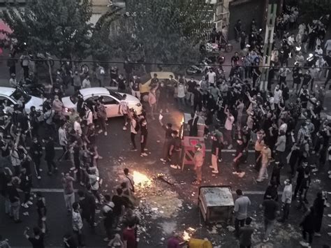Iran sentences 8 to prison over paramilitary’s death during last year’s nationwide protests