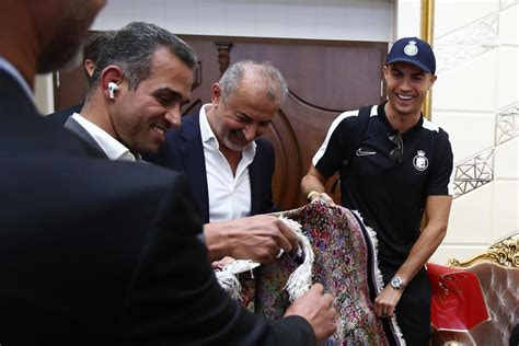 Iranian soccer fans flock to Cristiano Ronaldo’s hotel after he arrives in Tehran with Saudi team