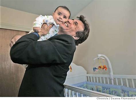 Iraqi woman Khalida lifts the shirt of her son Saleh Thanoon, 2, to ...