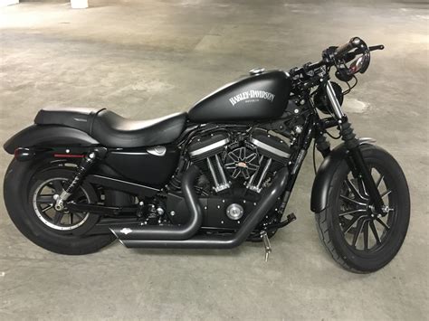 Iron 883. 2021 Harley-Davidson Iron 883. Physically, the Harley-Davidson Iron 883 is the runt of the brand’s full-sized bike litter. But there’s an upside. Being 2.185mm long, with a seat height of 760mm and a wet weight of 256kg, it’s nimbler, which makes it fun to throw into corners and really adds to its charm. With flat bars, mid mount controls ... 